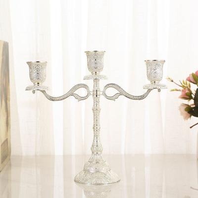 China Hot Selling Creative Retro Gold Metal Candlestick Wedding Candlestick Crafts Nordic Modern Metal Candlestick Holder for sale