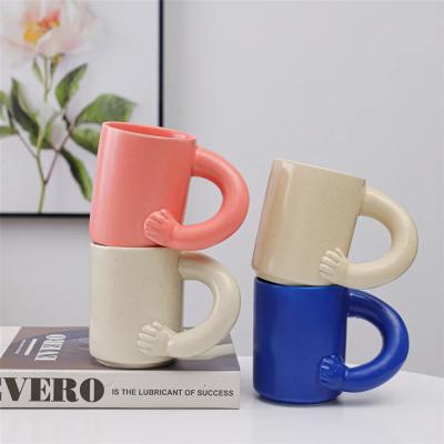 China Sustainable 345ml cute arm Ceramic cup fat handle mug with hand handgrip creative coffee ins breakfast couple water fat ceramic mugs cups for sale