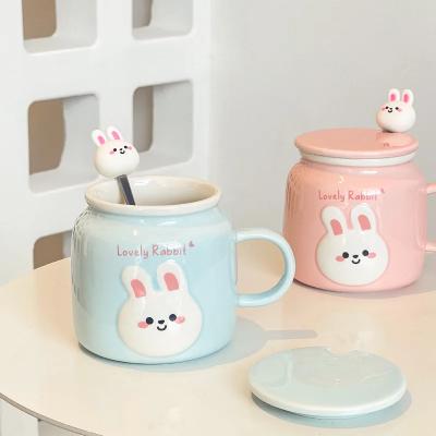 China Sustainable 500ml Newest trend Rabbit ceramic mug with spoon lid Cute cartoon couple coffee milk water handgrip mug for girl gift wholesale for sale