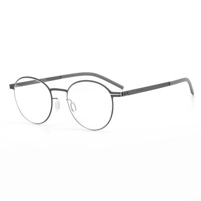 China Anti-blue lightweight optical glasses new simple and elegant pure titanium screwless round metal frames for women and men for sale