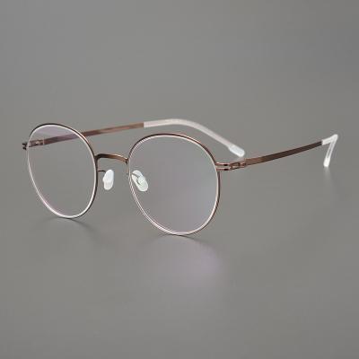 China Simple and elegant blue light blocking glass IP screwless pure titanium plating metal optical frame lightest glasses for sale