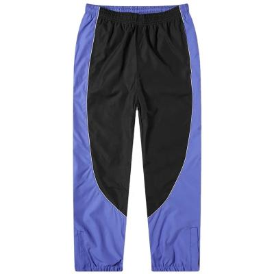 China Anti-Wrinkle Two Toned Warm Up Sportswear Pants Polyester Lining Lightweight Nylon Anorak Track Jogging Pants for sale