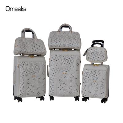 China OMSASK Hot Sale PU Spinner Spring Leather Material Wheel With Lady Bag PVC Luggage Set for sale