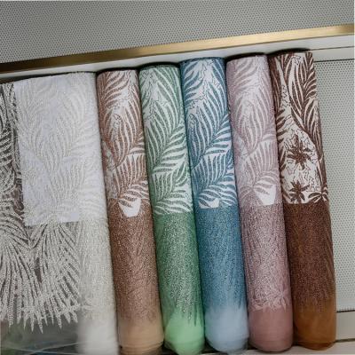 China Viable; Water Soluble Luxury Shiny Glitter Embroidered French Tulle Lace Fabric For Women Dresses Sugar Lace Fabric à venda