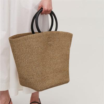 China High quality niche designer hand-held grass-woven bag female new 2021 summer beach large capacity suitable for seaside vacation for sale