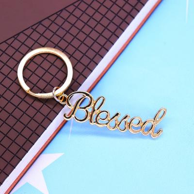 China Eco-Friendly Jewelry Customize Elegant Gold Plated Hollow Cut Metal Alloy Letter I Am Blessed Key Chain Key Rings for sale