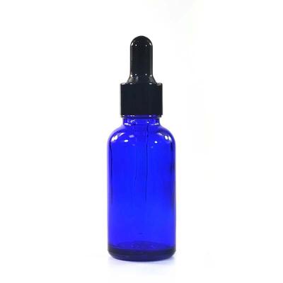 China Hot Sale High Quality Personal Care Glass Cosmetic Container Blue Essential Oil Bottle With Dropper for sale