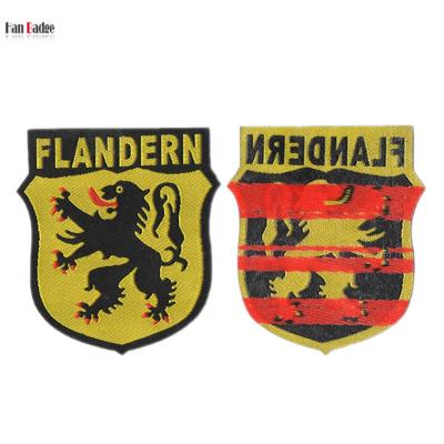 China Viable Custom Flandern Woven Labels Sew On Lion Design Weave Emblem For Apparel for sale