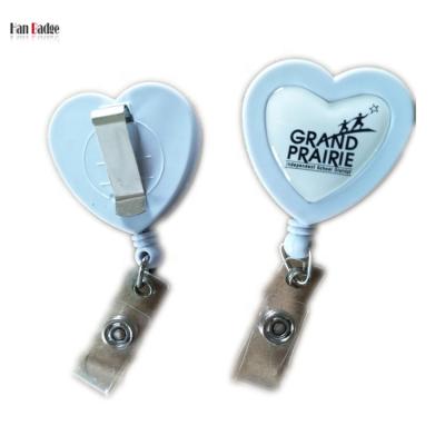 China ABS Plastic Retractable Badge Reels Heart Shape Custom Yoyo Reel With Back Clip Dome Epoxy Logo for sale