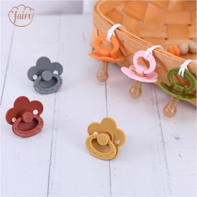 China BPA Free Eco Friendly Flower Shape Safety Food Grade Soft Silicone Baby Nipple Pacifier for sale