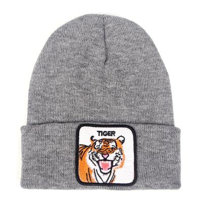 China New Winter Hats Patch COMMON Unisex Animal Embroidered Knitted Skull Cap for sale