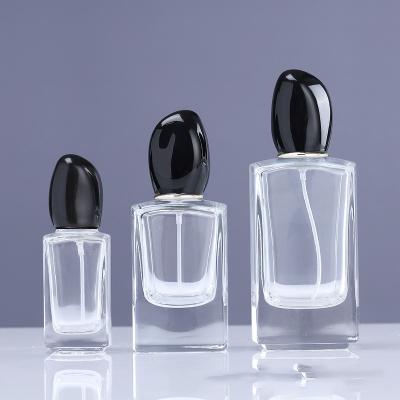 China Square 30ml 50ml 100ml High Qiality Square Wholesale Empty Spray Perfume Bottles Glass With OEM Black Lids for sale