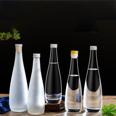 China Unique Wholesale 330ml 500ml Empty Clear Frosted Glass Bottles For Drinks With Screw Lid for sale