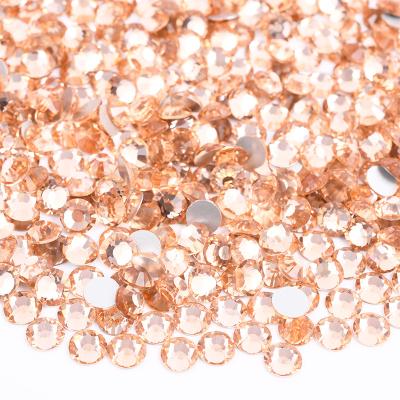 China Wholesale SS3 SS6 SS8 SS12 SS16 SS20 SS30 Round Flatback Crystal Rhinestone Light Peach Color Glass Rhinestones for sale