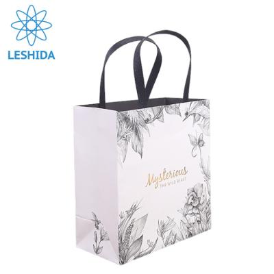 China Guangzhou Recyclable Custom Luxury Wedding Favor Dress Packaging Paper Bag With Ribbon Fancy Paper Shopping Bags for sale