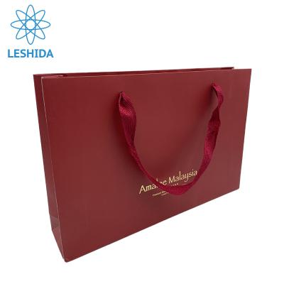 China Recyclable Custom Jewelry Kraft Paper Bag Embossed Logo Paper Bags Elegant Luxury Branded Jewelry for sale