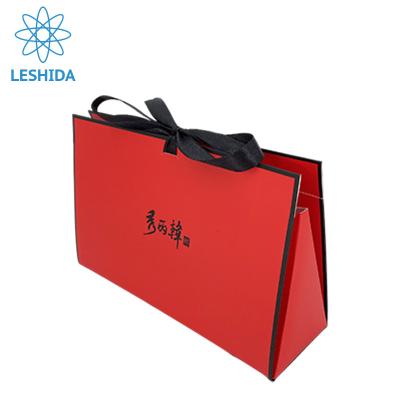 China OEM Recyclable Color Manufacturer Guangzhou Red Paper Bag With Ribbon Handle Customized Logo Printed Paper Bags for sale