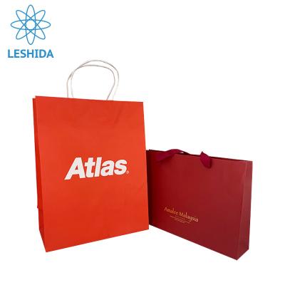 China Guangzhou Manufacturer Color Red Paper Sack Recyclable Kraft Paper Bags With Handle Clothing Paper Packaging Bag For Shopping for sale