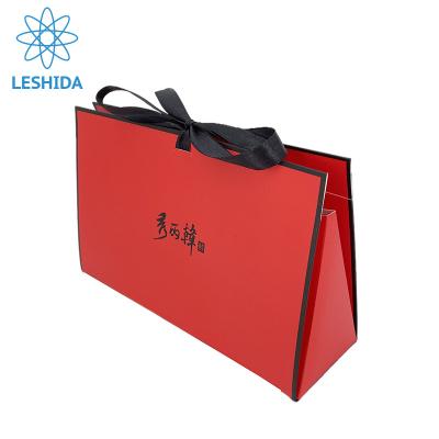 China Recyclable Red Color Paper Bag Ribbon Handle Gift Paper Bag Black Logo Jewelry Packaging Gift Bags for sale