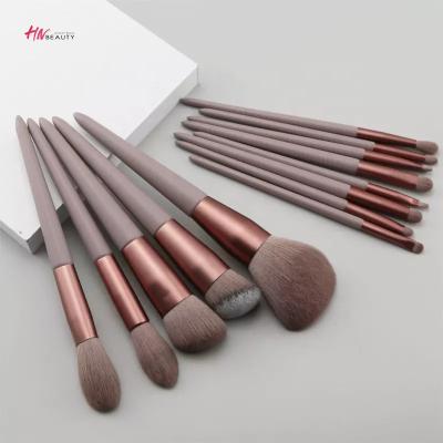 China Angular Blush Wholesale Hot Sale Luxury Green Pink Synthetic Hair 13pcs Wood Make Up Brush Set With Brush Bag Package Pouch for sale