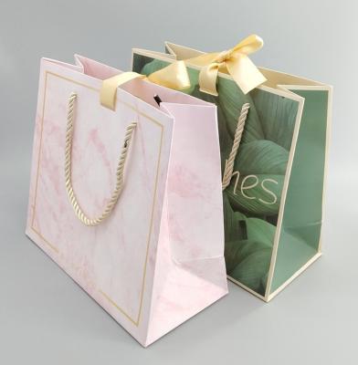 China Recyclable Accept Custom Order Clothes Paper Bags Cosmetic Packaging Bags for sale