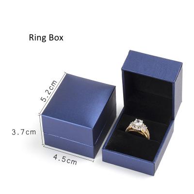 China Handmade Luxury Blue Paper Ring Box Inflatable Boxing Ring with Black Velvet Lining for sale