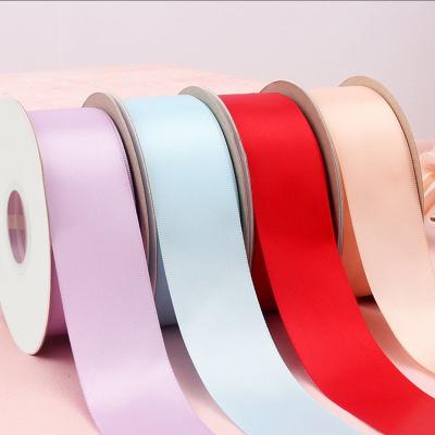 China Qingdao factory 100% pure color ribbons 19mm face satin fabric ribbon viable polyester wholesale double 32mm 25 yards per roll for sale