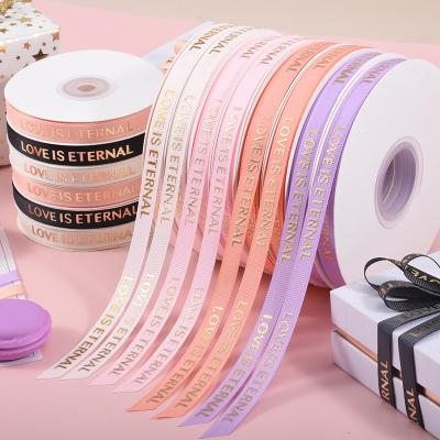 China Custom Iridescent Wholesale Gold Foil 1.0cm Printing Hot Stamping Gift Wrapping Petersham Ribbons Soft Touch Grosgrain Ribbon for sale