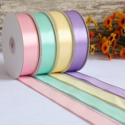 China Fashion viable attractive design colorful webbing satin fabric gift ribbon gold edge 15mm 38mm ribbons rolls wholesale for sale