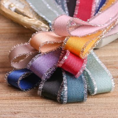 China Viable Wholesale High Quality 2.5cm Gift Box Wrapping Silver Glitter Gold Fringe Edge Grosgrain Ribbon Metallic Ribbons Webbing for sale