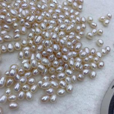 China Freshwater Pearl Half Drilled Wholesale Freshwater Cultured Rice Form Natural Genuine Loose Pearls Real White for sale