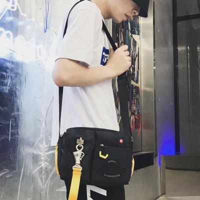 China Multifunctional Canvas Messenger Bag Retro Sling Backpack Cross - Body Vintage Small Shoulder Bag With Metal Hook Buckle for sale