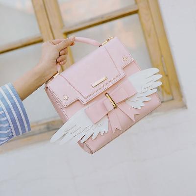 China Wing Design Fashion Pink Women's Handbag High Quality Cute Leather Shoulder Bag Multifunctional Messenger Bag With Bow for sale