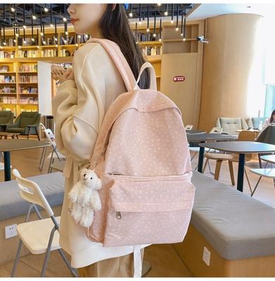 China Fashion Anti-theft Wholesale Lightweight Colorful Teens Pattern Kids Large Messenger School Bag Backpack With White Furry Bear Pendant for sale