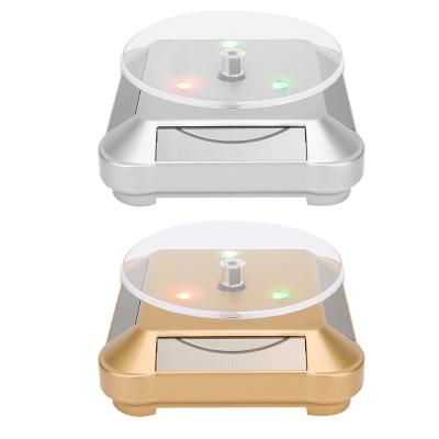 China Light Solar Powered ABS LED 360 Jewelery Display Stand Showcase Necklace Bracelet Rotating Watch Ring Show Turntable for sale