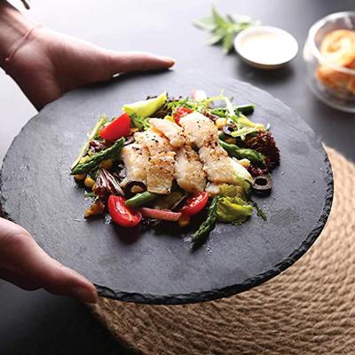 China Sustainable wholesale round Dia25 x 0.6cm black slate set charcuterie plates pizza food catering serving dishes plates for sale