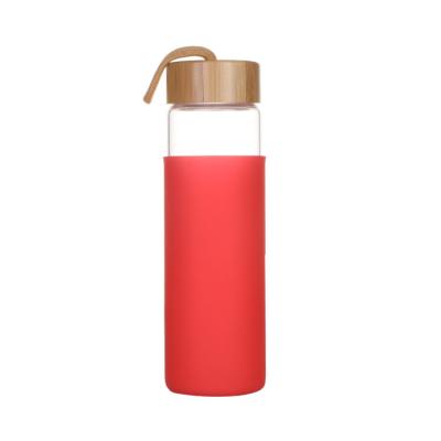 China Viable Leak Proof Plant Lid Borosilicate Glass Bamboo Water Bottle With Custom Silicone Cover for sale