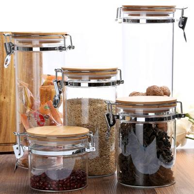 China Sustainable Home Storage Glass Canister Set Clip Top 50ml 100ml Glass Spice Jar With Wooden Lid for sale