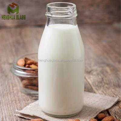 China Free Sample 250ml 7oz Round Milk Bottle Glass Beverage Drink Juice Glass Bottle With Metal Lid for sale