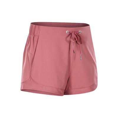 China Anti-Wrinkle Women Summer Loosen Solid Color Quick Dry Athletic Gym Sports Fitness Shorts With Pockets for sale