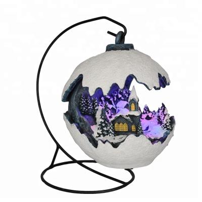 China Polyresin Navidad Hanging Ball Shaped Musical Decorative Led Lighting Up Polyresin Christmas Decor for sale