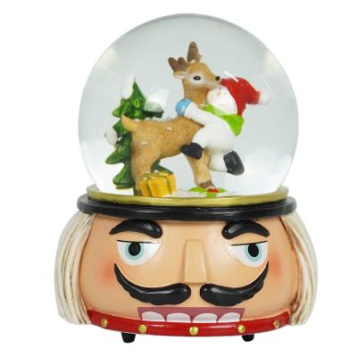 China Europe Customized Christmas Xmas Scene Wind Up Music Box Christmas Nutcracker Water Snow Globe for sale