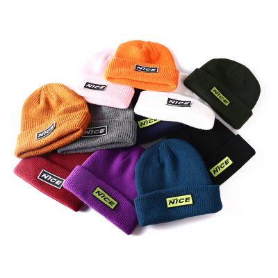 China JOINT Wholesale Custom Label Cable Knit Beanie for sale