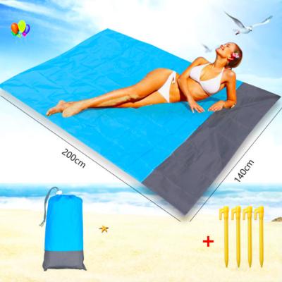 China Outdoor Camping Hiking Oversized Travel Mat Lightweight Outdoor Picnic Mat Sand Proof Beach Blanket with 4 Sand Corner Pockets and Plastic Stakes for sale