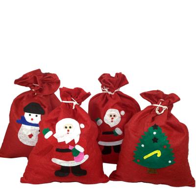 China 2021 Special Delivery Eco-friendly Large Nonwoven Gift Bag Plush Gift Bag Nonwoven Printed Red Ribbon Felt Satin Santa Sack for sale