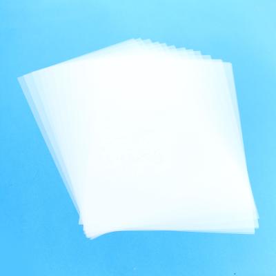 China Single side A4 size PET transfer film for printing Direct transfer film for printing and DTF ink printing PET film A4 transfer for sale