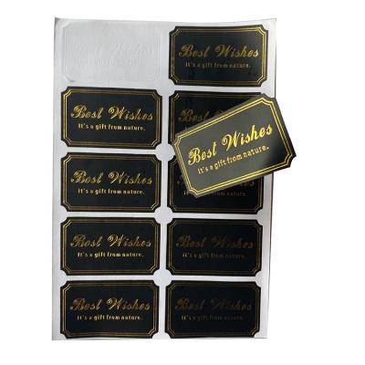 China Anti-Counterfeit Matte Finish Black Gold Foil Die Cut Self Adhesive Customized Printing Stickers For Package for sale