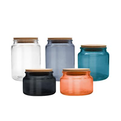 China Wholesale Home Decoration Food Storage Glass Jars Airtight 500ml Kitchen Empty Storage Glass Jars Colored Candle Glass Jars With Bamboo Lid for sale