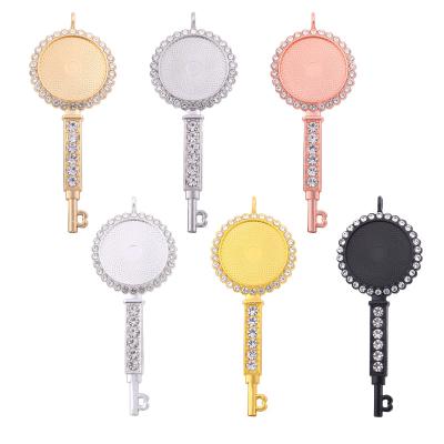 China FASHIONABLE round rhinestone Amazon key shape 25mm round crystal empty pendant tray charms with sublimation for sale