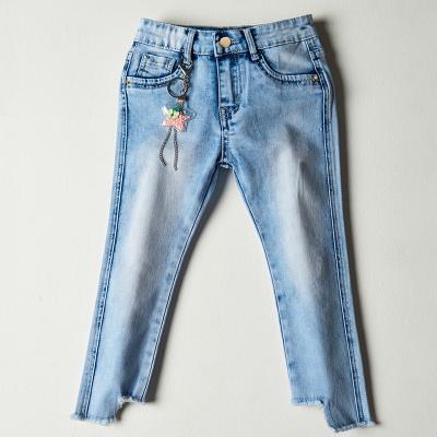 China New fashion boys girls overall youth fringed uneven edge knee tear denim long pants for sale